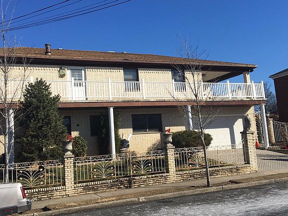 Wrap around terrace with patio/bbq section in back. New rails