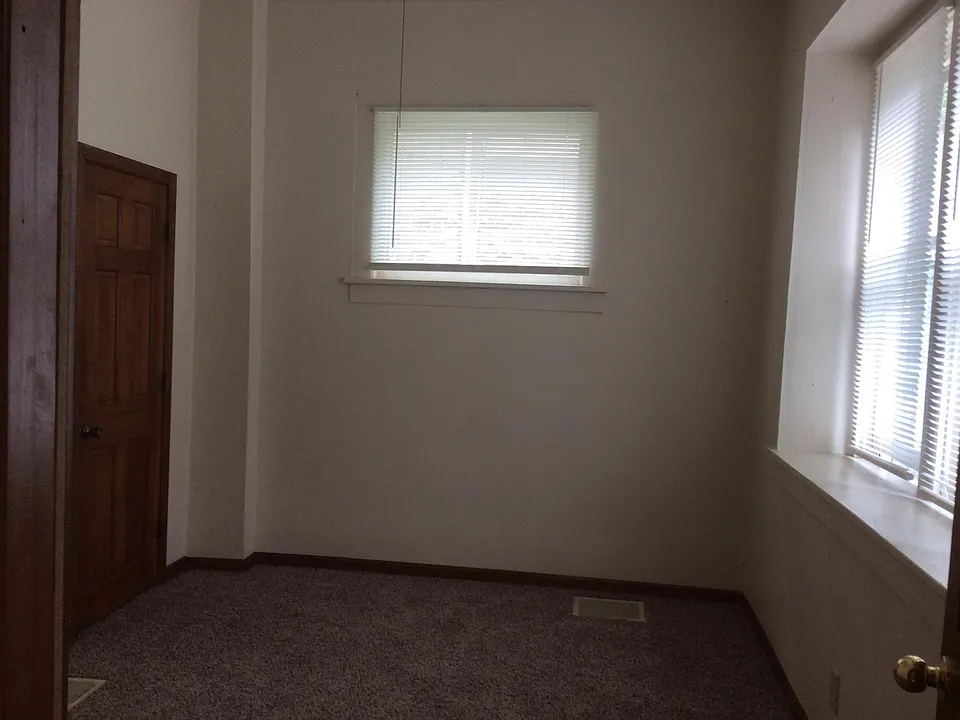 Back bedroom with nice natural lighting, new carpet and ceil