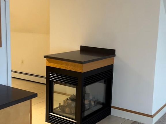 gas fireplace (Divides Kitchen from Main Living Space)