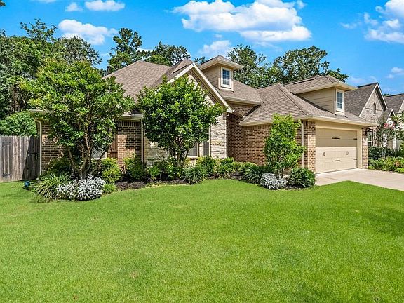 This move-in ready home is surrounded with lush landscaping