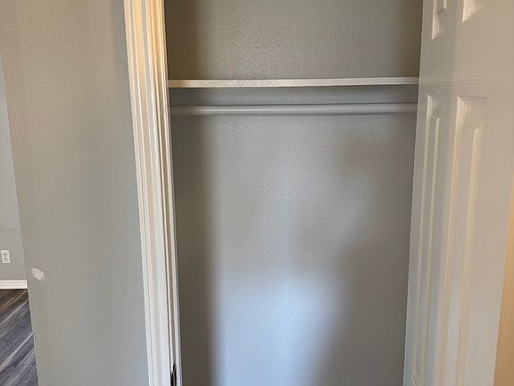 Coat closet across Bathroom
