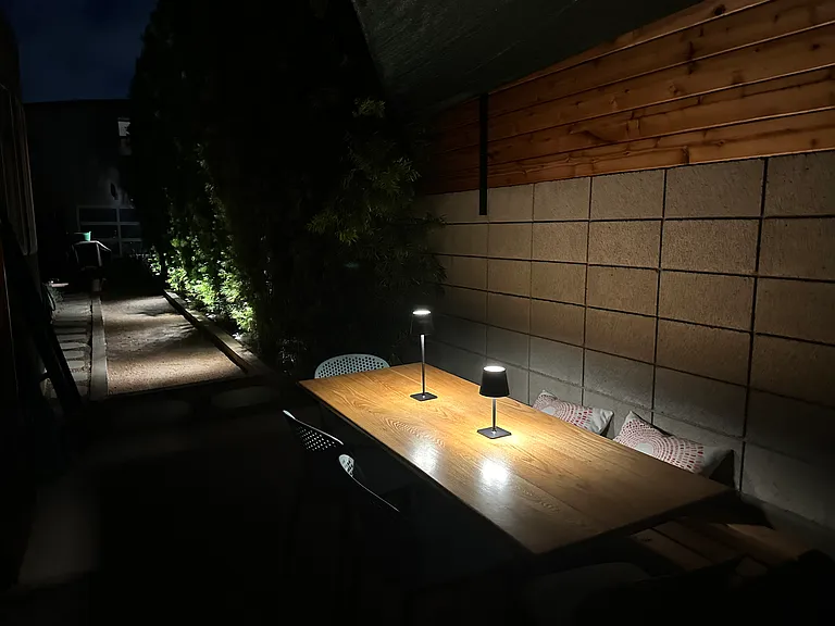 Outdoor dining area, bocce court at night