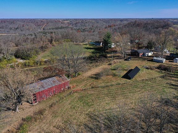 Aerial drone shot of the home, barn and other buildings