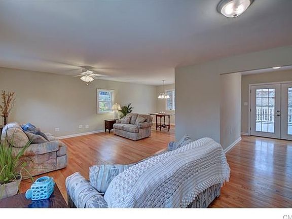 View from front door overlooking living room, dining room, and French doors lead to rear deck.