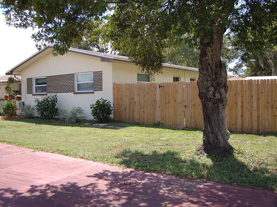 Spacious block home sitting on a large, fenced corner lot