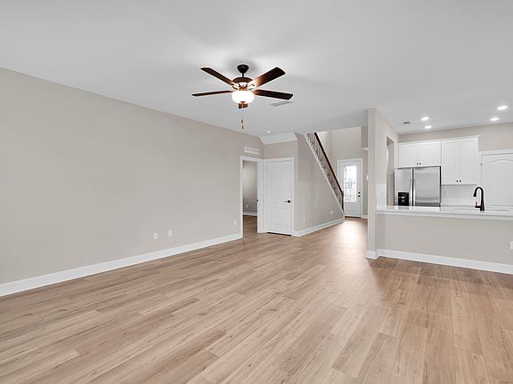 The open-layout proves ample space for hosting, entertaining, or spacious everyday relaxation.