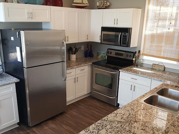 Updated kitchen with granite countertops and stainless appliances