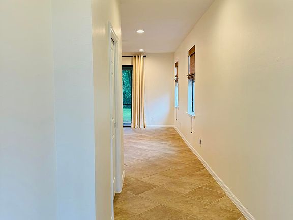 Entry with powder room to the left.