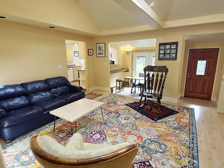 Airy living room with Roku TV, WiFi and comfy furniture.