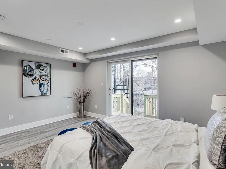 Bedroom with modern flooring and neutral paint