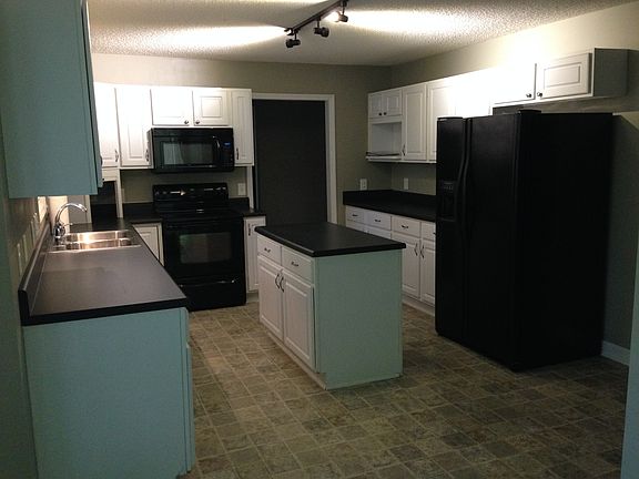 Large, eat-in kitchen has tons of counterspace and storage c