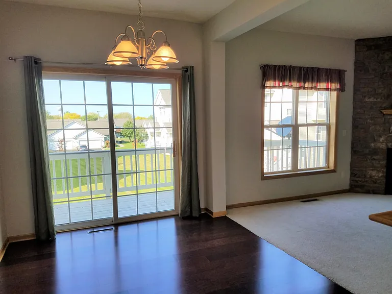Dining room walkout to balcony, overlooks green space