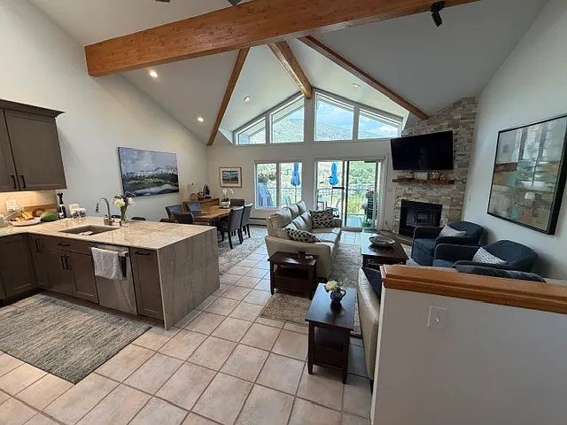 Main floor with kitchen, living area, dining area, Master Bedroom, and Master Bathroom, and East and West decks.