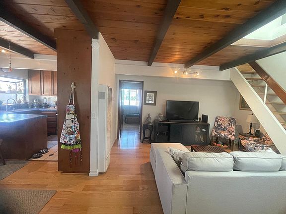 View from entry into living and bedroom areas.