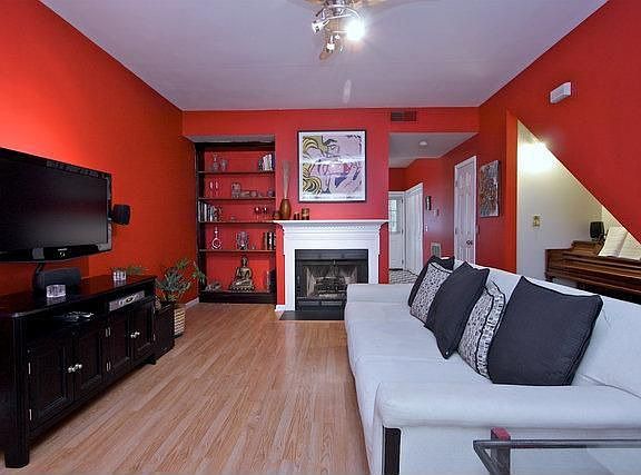 The living room boasts updated fixtures and built in shelves