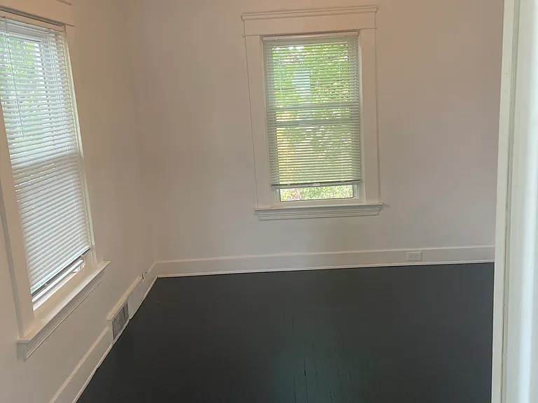 Back bedroom off of living room with view of large back yard