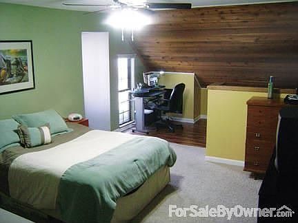 The master bedroom has a large closet, adjoining office space & a private bath