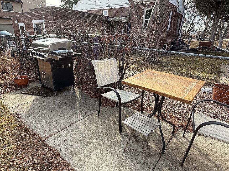 Table and gas grill in shared yard