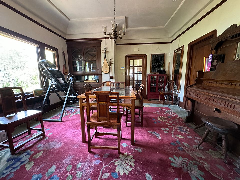 Dining room (shared)
Inversion chair (left), antique pump organ (right), antique Chinese table/chairs.