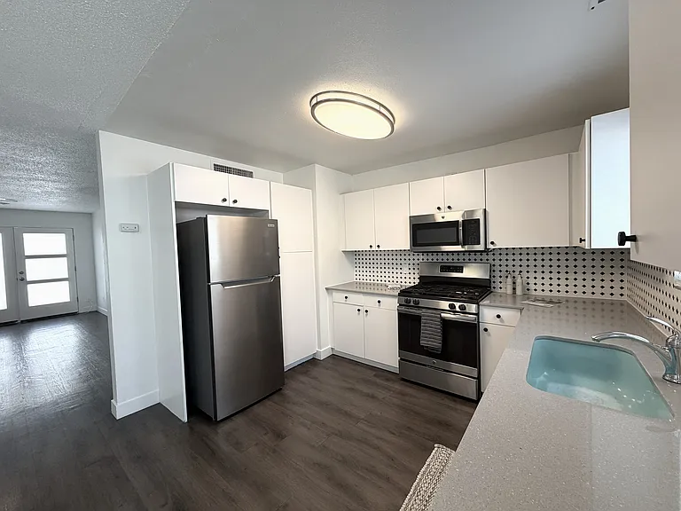 Gas range, new fridge, new dishwasher, and extra kitchen storage