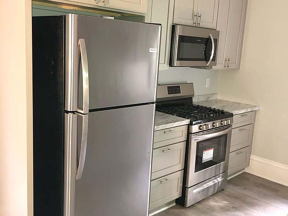 New kitchen with new stainless steel appliances. Flooded with light.