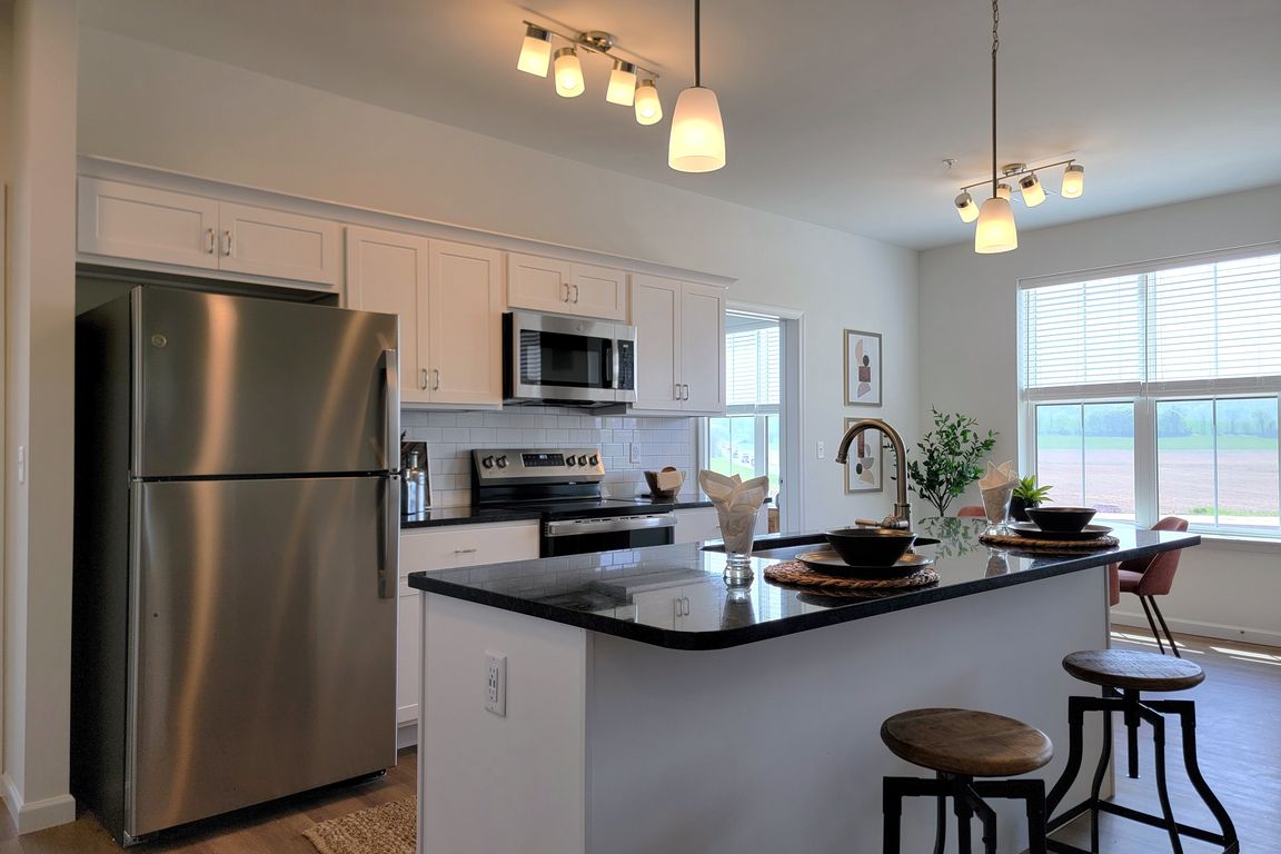 Legacy Floor Plan - Kitchen with Stainless Steel Appliances and Granite Countertops