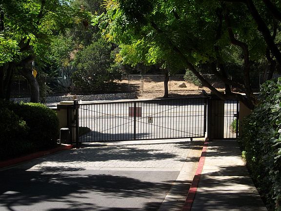 Security driveway gate and side entry gate