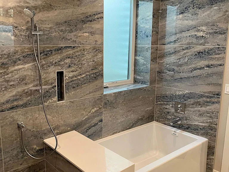 The soaking tub is oversized at 36" wide.