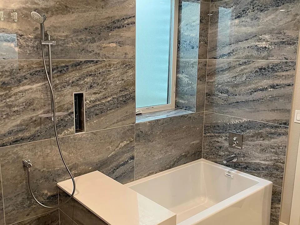 The soaking tub is oversized at 36" wide.