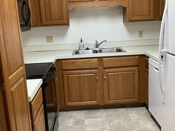 Kitchen complete complete with smooth top range, & over the range microwave, refrigerator, disposal and dishwasher