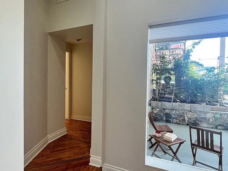 View to private patio with second entrance and off-street parking