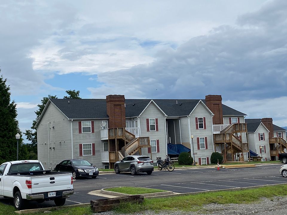 View of building, unit is on back left, ground level