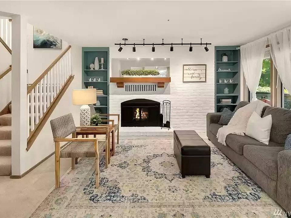 Living room on the main level with lots of light and views of the pond just outside.