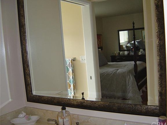 Master bath/dressing room mirror looking into Master Bedroom