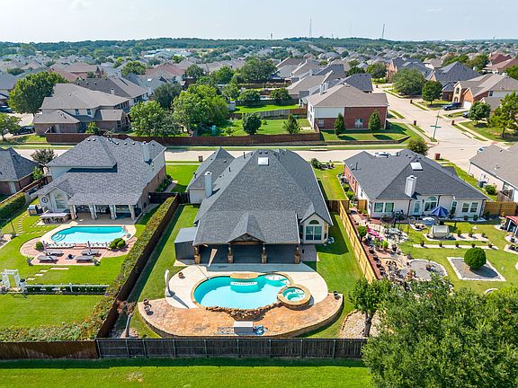 Aerial view of the back of the property with the pool.