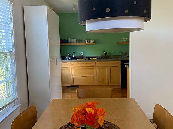 looking into the well equipped kitchen with pantry on the left