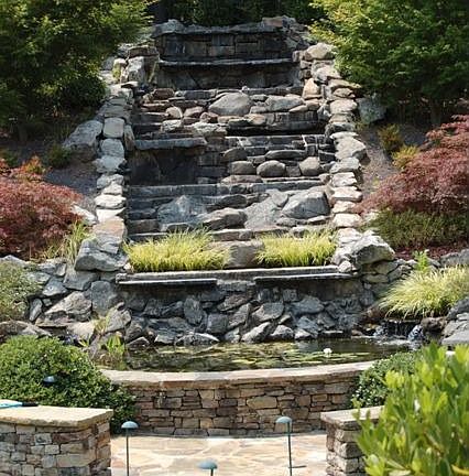 Multi-tiered waterfall with Koi Pond