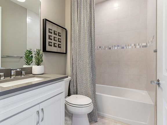 Secondary bathroom with elegant wall tile