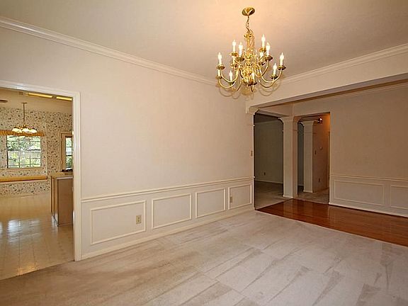 NOTICE THE WOOD FLOOR ENTRY AND DOUBLE CROWN MOLDING