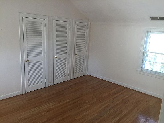 2 side clothes closets with center HVAC unit