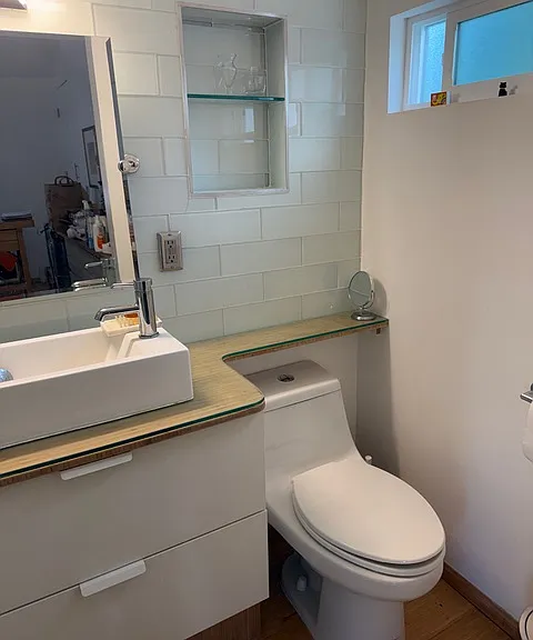 Bathroom w sliding door and glass shower