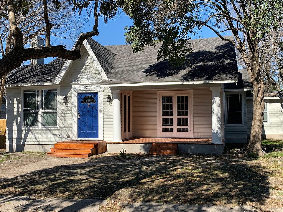 This charming home is warm and inviting as you walk up to the front door. Look at that large covered front porch!