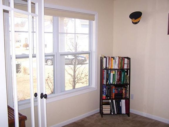 The large windows add great light to the den.