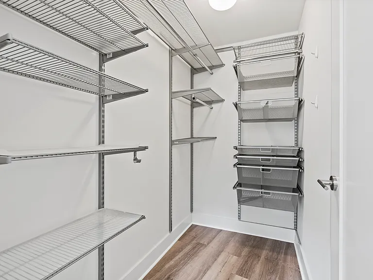 Primary bedroom walk-in closet