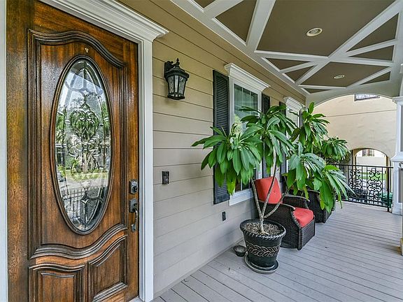 Attention to detail abounds - on porch ceilings, pillars and the solid wood front door with leaded glass