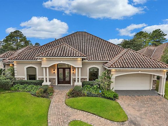 THREE CAR TANDEM GARAGE WITH EXTRA STORAGE - This amazing one story home features three bedrooms with en suite bathrooms, large formal dining room with a wide opening to the kitchen and butlers pantry, and open floor plan with large kitchen and den. 