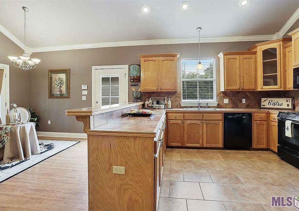 Open concept kitchen with view of Deck and Cathedral Ceilings