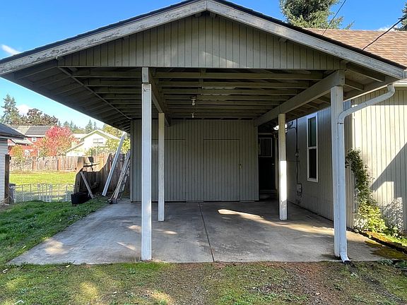 Large Carport with storage locker
