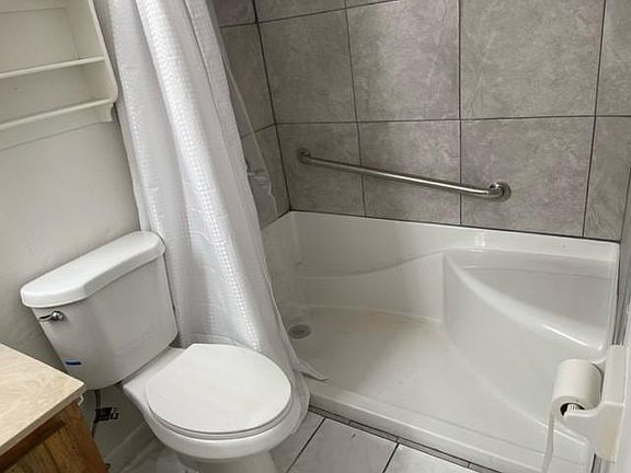 shower with sitting and holding bar for seniors