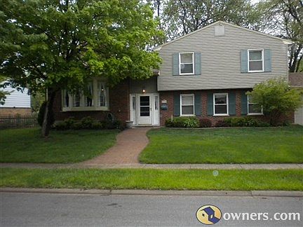 Brick sidewalk leads to home